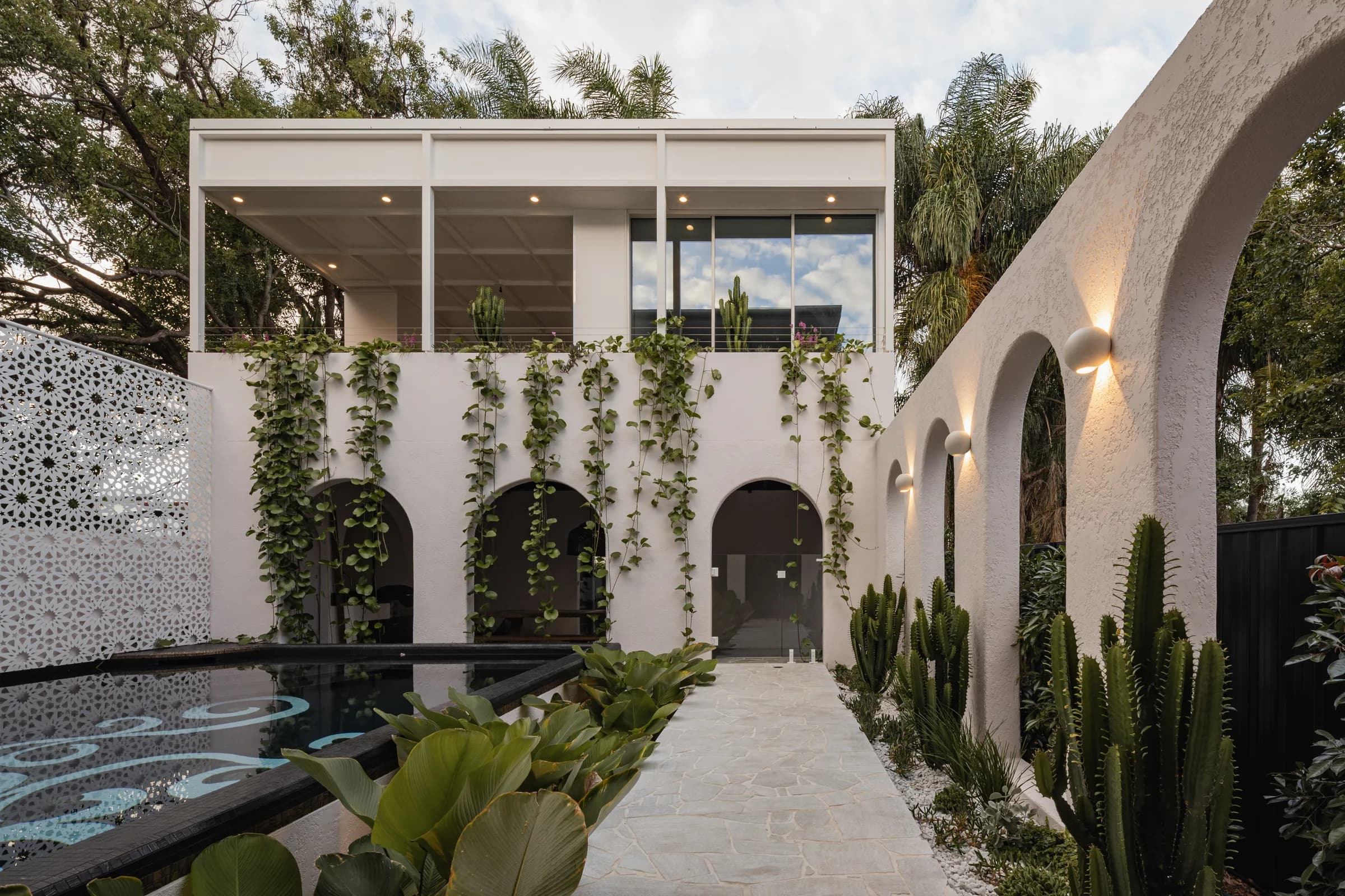 Mark Street — white rendered Brisbane home with arched walkway and pool.